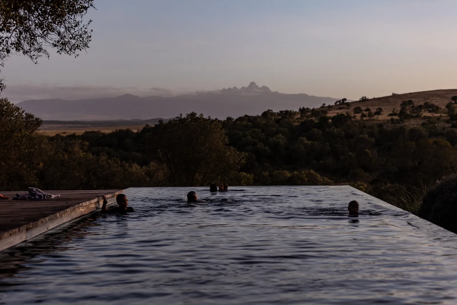 Infinity pool at dusk with Mount Kenya in the distance